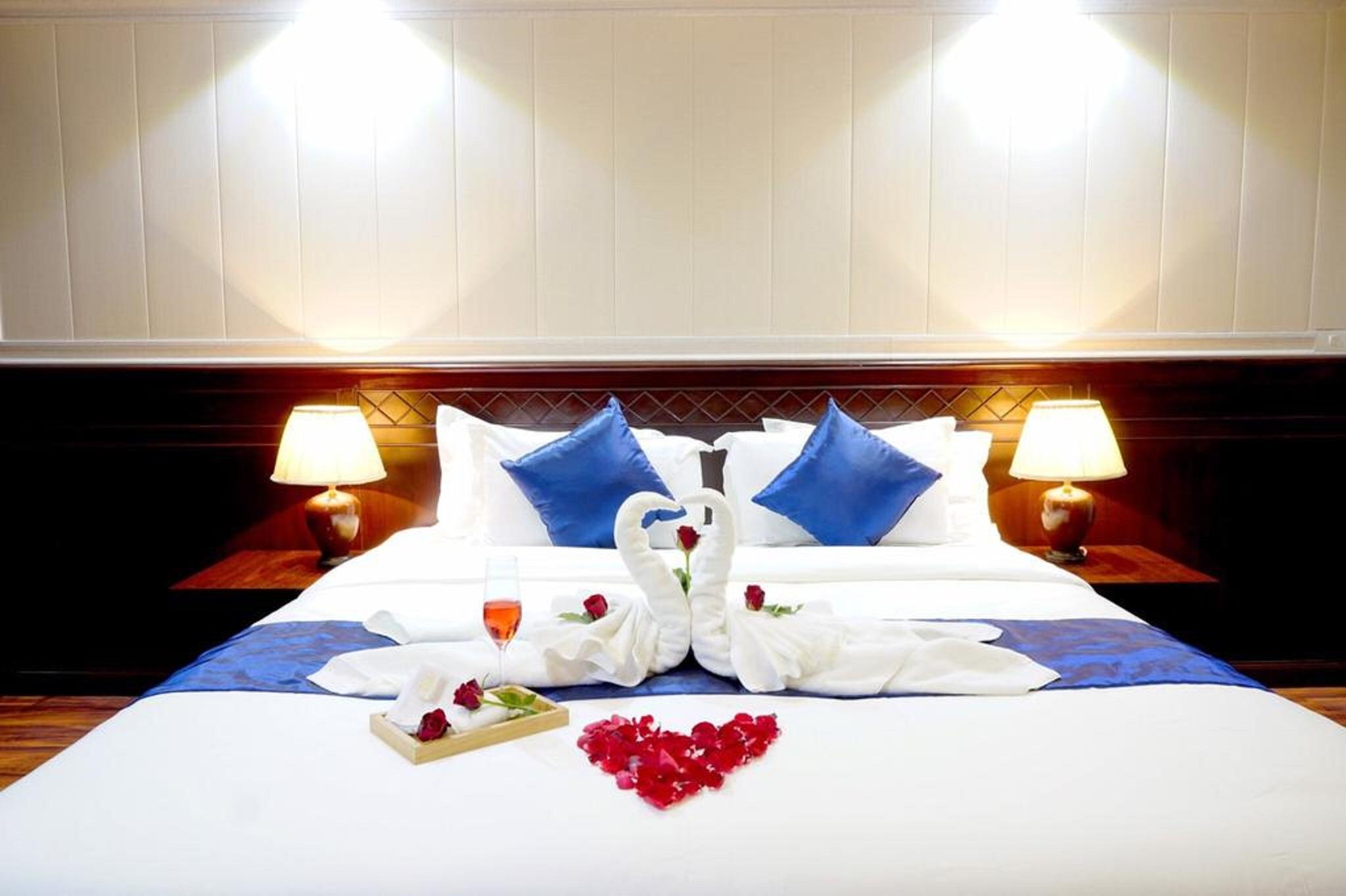 Miloft Sathorn Hotel - Sha Plus Certified Bangkok Exteriör bild A bed with a heart-shaped arrangement of flowers